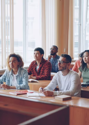 A group of students sitting in a classroom.